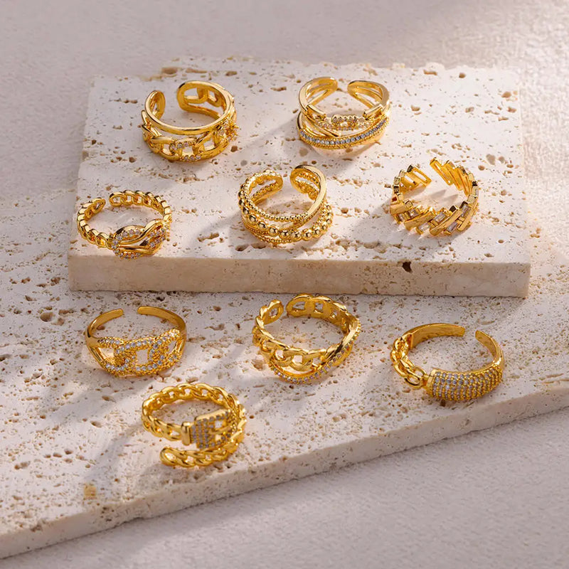 Brilhe com Estilo: Espetaculares Anéis de Aço Inoxidável Dourado (na cor Ouro), com Design Vazado e Cristal Zircônia